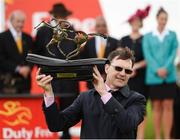 1 July 2017; Trainer Aidan O'Brien lifts the trophy after winning the Dubai Duty Free Irish Derby with Capri, ridden by Seamie Heffernan, during the Dubai Duty Free Irish Derby Festival 2017 on Saturday at the Curragh in Kildare. Photo by Seb Daly/Sportsfile