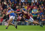 1 July 2017; Aidan McCormack of Tipperary is blocked down by Gary Greville of Westmeath during the GAA Hurling All-Ireland Senior Championship Round 1 match between Tipperary and Westmeath at Semple Stadium in Thurles, Co Tipperary. Photo by Diarmuid Greene/Sportsfile
