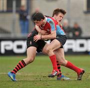 26 February 2012; Ciaran Divney, C.U.S, is tackled by Sam Sterling, Kilkenny College. Powerade Leinster Schools Senior Cup, 2nd Round, C.U.S v Kilkenny College, Donnybrook Stadium, Donnybrook, Dublin. Picture credit: Barry Cregg / SPORTSFILE