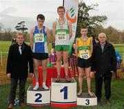26 February 2012; Peter Dolan, left, Marketing Manager of Woodies DIY, and Liam Hennessy, right, President of Athletics Ireland, with top finishers in the Junior Men's race during the Woodie’s DIY AAI Inter Club Cross Country Championships of Ireland 2012, from left, Stephen Kerr, Armagh AC, second place, Kevin Dooney, Raheny Shamrock's AC, winner, and Jake O'Regan, St. Johns AC, third place. Santry Demesne, Santry, Dublin. Picture credit: Pat Murphy / SPORTSFILE