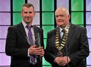 26 February 2012; In attendance at the Three FAI International Football Awards is Adrian Clarke, winner of the Football for All International player of the year, Donegal Special Olympics Club member, with Paddy McCaul, President of the FAI. Three FAI International Football Awards, RTÉ Studios, Donnybrook, Dublin. Picture credit: David Maher / SPORTSFILE