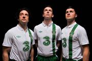 27 February 2012; Three, proud sponsors of the Republic of Ireland football team, today launches the new Umbro Republic of Ireland away jersey. Pictured wearing the new kit are Republic of Ireland players, from left, Stephen Hunt, Kevin Foley, and Shane Long. The Three sponsored jersey is available now and will be worn for the first time on the pitch for the Republic of Ireland’s Euro 2012 warm up friendly match against the Czech Republic on Wednesday 29th February. To celebrate the launch, Three is giving away 8 pairs of tickets to the match, just go to www.facebook.com/3Football for more details, terms and conditions and apply. Gannon Park, Malahide, Co. Dublin. Picture credit: David Maher / SPORTSFILE