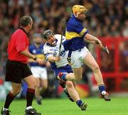 30 June 2002; Eamonn Corcoran, Tipperary, in action against Waterford's Paul Flynn. Waterford v Tipperary, Guinness Munster Hurling Final, Pairc Ui Chaoimh, Cork. Picture credit; Ray McManus / SPORTSFILE