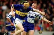 30 June 2002; Lar Corbett, Tipperary, in action against Waterford's Brian Flannery. Waterford v Tipperary, Guinness Munster Hurling Final, Pairc Ui Chaoimh, Cork. Picture credit; Ray McManus / SPORTSFILE