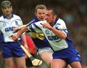 30 June 2002; Peter Queally, Waterford, in action against Conor Gleeson, Tipperary. Waterford v Tipperary, Guinness Munster Hurling Final, Pairc Ui Chaoimh, Cork. Picture credit; Ray McManus / SPORTSFILE