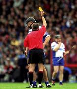 30 June 2002; Waterford's Seamus Prendergast is shown a yellow card by referee Aodan MacSuibhne. Waterford v Tipperary, Guinness Munster Hurling Final, Pairc Ui Chaoimh, Cork. Picture credit; Ray McManus / SPORTSFILE