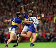 30 June 2002; Seamus Prendergast, Waterford, in action against Tipperary's Thomas Dunne (8) and David Kennedy. Waterford v Tipperary, Guinness Munster Hurling Final, Pairc Ui Chaoimh, Cork. Picture credit; Ray McManus / SPORTSFILE