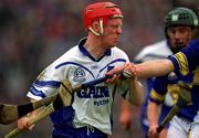 30 June 2002; John Mullane, Waterford, in action against Thomas Dunne, Tipperary. Waterford v Tipperary, Guinness Munster Hurling Final, Pairc Ui Chaoimh, Cork. Picture credit; Ray McManus / SPORTSFILE