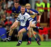 30 June 2002; Brian Flannery, Waterford, in action against Tipperary's Lar Corbett and Brian O'Meara, left. Waterford v Tipperary, Guinness Munster Hurling Final, Pairc Ui Chaoimh, Cork. Picture credit; Ray McManus / SPORTSFILE