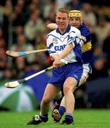 30 June 2002; Brian Flannery, Waterford, in action against Lar Corbett, Tipperary. Waterford v Tipperary, Guinness Munster Hurling Final, Pairc Ui Chaoimh, Cork. Picture credit; Ray McManus / SPORTSFILE