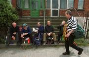 7 July 2002; A street vendor passes Wexford supporters, from left, Sean McGee, Billy Nolan, Nicholas Murphy, Fintan Doyle and Paddy Doyle, as they enjoy a cup of tea and a sandwich on their way to the game. Kilkenny v Wexford, Guinness Leinster Senior Hurling Championship Final, Croke Park, Dublin. Hurling. Picture credit; Ray McManus / SPORTSFILE