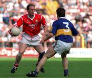 24 July 2002; Cork's Larry Tompkins in action against Tipperary's Peter Gleeson. Cork v Tipperary, Munster Football Final, Pairc Ui Chaoimh, Cork. Picture credit; Ray McManus / SPORTSFILE