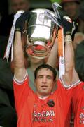 7 July 2002; Armagh captain Kieran McGeeney lifts the Anglo Celt Cup. Armagh v Donegal, Ulster Football Final, St Tighearnachs Park, Clones, Co. Monaghan. Picture credit; David Maher / SPORTSFILE