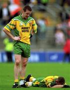 7 July 2002; Raymond Sweeney, (standing) and Noel McGinley, Donegal pictured at the final whistle. Armagh v Donegal, Ulster Football Final, St Tighearnachs Park, Clones, Co. Monaghan. Picture credit; David Maher / SPORTSFILE