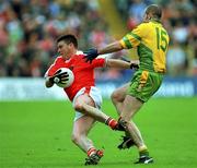 7 July 2002; Kieran Hughes, Armagh in action against Paul McGonigle, Donegal, Armagh v Donegal, Ulster Football Final, St Tighearnachs Park, Clones, Co. Monaghan. Picture credit; Damien Eagers / SPORTSFILE
