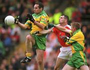 7 July 2002; Shane Carr, (left) Donegal in action against Steven McDonnell, Armagh supported by teammate, Noel McGinley, Armagh v Donegal, Ulster Football Final, St Tighearnachs Park, Clones, Co. Monaghan. Picture credit; David Maher / SPORTSFILE