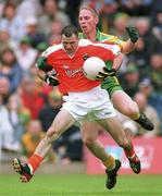 7 July 2002; Steven McDonnell, Armagh in action   against Noel McGinley, Donegal, Armagh v Donegal, Ulster Football Final, St Tighearnachs Park, Clones, Co. Monaghan. Picture credit; David Maher / SPORTSFILE