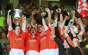 7 July 2002; Kieran McGeeney, Armagh, lifts the   Anglo Celt Cup while surrounded by his team-mates. Armagh v Donegal, Ulster Football Final, St Tighearnachs Park, Clones, Co. Monaghan. Picture credit; Damien Eagers / SPORTSFILE