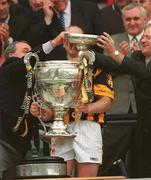 7 July 2002; Leinster Council Chairman, Nickey Brennan, left, and Guinness Sponsorship Manager, Michael Whelan, reach to catch the lid of the Bob O'Keefe trophy after it had come loose during the presentation. Kilkenny v Wexford, Guinness Leinster Senior Hurling Championship Final, Croke Park, Dublin. Hurling. Picture credit; Ray McManus / SPORTSFILE