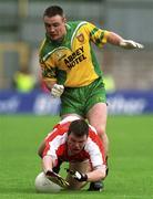 7 July 2002; Ronan Clarke, Armagh in action against John Gildea, Donegal. Armagh v Donegal, Ulster   Football Final, St Tighearnachs Park, Clones, Co. Monaghan. Picture credit; Damien Eagers / SPORTSFILE