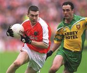 7 July 2002; Oisin McConville, Armagh, in action   against Damien Diver, Donegal. Armagh v Donegal, Ulster Football Final, St Tighearnachs Park, Clones, Co. Monaghan. Picture credit; Damien Eagers / SPORTSFILE
