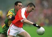 7 July 2002; Oisin McConville, Armagh, in action against Damien Diver, Donegal. Armagh v Donegal, Ulster Football Final, St Tighearnachs Park, Clones, Co. Monaghan. Picture credit; Damien Eagers / SPORTSFILE