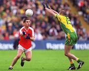 7 July 2002; Paul McGrane, Armagh, in action   against Paul McGonigle, Donegal. Armagh v Donegal, Ulster Football Final, St Tighearnachs Park, Clones, Co. Monaghan. Picture credit; Damien Eagers / SPORTSFILE