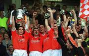 8 July 2002; Armagh captain Kieran McGeeney lifts the Anglo Celt Cup surrounded by team-mates. Armagh v Donegal, Ulster Football Final, St Tighearnachs Park, Clones, Co. Monaghan. Picture credit; Damien Eagers / SPORTSFILE