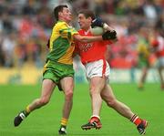 8 July 2002; Kieran McGeeney, Armagh, in action against Christy Toye, Donegal. Armagh v Donegal, Ulster Football Final, St Tighearnachs Park, Clones, Co. Monaghan. Picture credit; Damien Eagers / SPORTSFILE