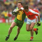 8 July 2002; Adrian Sweeney, Donegal, in action against Armagh's Justin McNulty. Armagh v Donegal, Ulster Football Final, St Tighearnachs Park, Clones, Co. Monaghan. Picture credit; Damien Eagers / SPORTSFILE