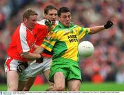 8 July 2002; Christy Toye, Donegal, in action against Armagh's Francie Bellew. Armagh v Donegal, Ulster Football Final, St Tighearnachs Park, Clones, Co. Monaghan. Picture credit; Damien Eagers / SPORTSFILE