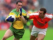 8 July 2002; Brendan Devenney, Donegal, in action against Armagh's Enda McNulty. Armagh v Donegal, Ulster Football Final, St Tighearnachs Park, Clones, Co. Monaghan. Picture credit; Damien Eagers / SPORTSFILE
