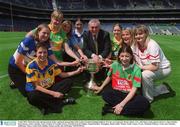 9 July 2002; Pictured at the announcement of the continued sponsorship of the Ladies Football Championship by TG4 are An Taoiseach, Bertie Ahern, T.D., with Inter county players from l-r; Mary Beades, Roscommon, Anna Connolly, Laois, Grainne Ni Laoithe, Kerry, Martina Farrell, Dublin, Niamh Kindlon, Monaghan, Elaine Duffy, Meath, Noelle Comyn, CLare, Michaela Doherty, Trone and Christina Heffernan, Mayo. Croke Park, Dublin. Picture credit; Ray McManus / SPORTSFILE
