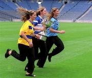 9 July 2002; Pictured at the announcement of the continued sponsorship of the Ladies Football Championship by TG4 from l-r, Noelle Comyn, Clare, Anna Connolly, Laois and Martina Farrell Dublin. Croke Park, Dublin. Picture credit; Ray McManus / SPORTSFILE