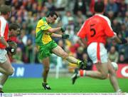 8 July 2002; Donegal's Jim McGuinness scores his sides openng goal. Armagh v Donegal, Ulster Football Final, St Tighearnachs Park, Clones, Co. Monaghan. Picture credit; David Maher / SPORTSFILE