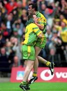8 July 2002; Jim McGuinness, right, celebrates with team-mate Adrian Sweeneyafter scoring Donegal's first goal. Armagh v Donegal, Ulster Football Final, St Tighearnachs Park, Clones, Co. Monaghan. Picture credit; David Maher / SPORTSFILE