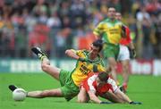8 July 2002; Jim McGuinness, Donegal, in action against Armagh's Paul McGrane. Armagh v Donegal, Ulster Football Final, St Tighearnachs Park, Clones, Co. Monaghan. Picture credit; David Maher / SPORTSFILE