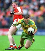 8 July 2002; Colm McFadden, Donegal, in action against Francie Bellew, Armagh. Armagh v Donegal, Ulster Football Final, St Tighearnachs Park, Clones, Co. Monaghan. Picture credit; David Maher / SPORTSFILE