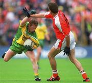 8 July 2002; Brian Roper, Donegal, in action against Philip Loughran, Armagh. Armagh v Donegal, Ulster Football Final, St Tighearnachs Park, Clones, Co. Monaghan. Picture credit; David Maher / SPORTSFILE