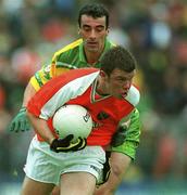8 July 2002; Ronan Clarke, Armagh, in action against Jim McGuinness, Donegal. Armagh v Donegal, Ulster Football Final, St Tighearnachs Park, Clones, Co. Monaghan. Picture credit; David Maher / SPORTSFILE