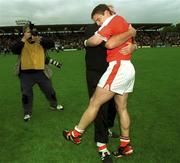 8 July 2002; Armagh captain Kieran McGeeney pictured with manager Joe Kernan at the end of the match. Armagh v Donegal, Ulster Football Final, St Tighearnachs Park, Clones, Co. Monaghan. Picture credit; Damien Eagers / SPORTSFILE