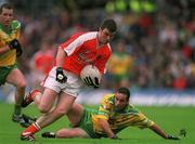 8 July 2002; Ronan Clarke, Armagh, in action against Shane Carr, Donegal. Armagh v Donegal, Ulster Football Final, St Tighearnachs Park, Clones, Co. Monaghan. Picture credit; David Maher / SPORTSFILE