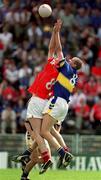 14 July 2002; Nicholas Murphy, Cork, is tackled by Tipperary's Kevin Mulryan. Cork v Tipperary, Bank of Ireland Munster Senior Football Final, Semple Stadium, Thurles, Co. Tipperary. Picture credit; Brendan Moran / SPORTSFILE