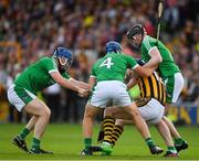 1 July 2017; T J Reid of Kilkenny in action against Richie McCarthy, left, Michael Casey, 4, and Declan Hannon of Limerick during the GAA Hurling All-Ireland Senior Championship Round 1 match between Kilkenny and Limerick at Nowlan Park in Kilkenny. Photo by Ray McManus/Sportsfile