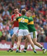 2 July 2017; Donncha O'Connor of Cork during a coming together with Fionn Fitzgerald, 2, and Peter Crowley of Kerry during the Munster GAA Football Senior Championship Final match between Kerry and Cork at Fitzgerald Stadium in Killarney, Co Kerry. Photo by Eóin Noonan/Sportsfile