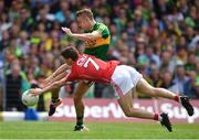2 July 2017; James O'Donoghue of Kerry attempts a shot on goal despite the best efforts of Kevin Crowley of Cork during the Munster GAA Football Senior Championship Final match between Kerry and Cork at Fitzgerald Stadium in Killarney, Co Kerry. Photo by Brendan Moran/Sportsfile