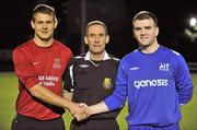 28 February 2012; Athlone IT captain James Scallan shakes hands with IT Carlow captain Neil Harney alongside referee Tony McGuinness before the game. Umbro CUFL Premier Division Final, IT Carlow v Athlone IT, Frank Cooke Park, Glasnevin, Dublin. Picture credit: Barry Cregg / SPORTSFILE