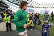25 February 2012; Ireland's Donncha O'Callaghan passes the RBS Six Nations Championship trophy as he makes his way onto the pitch before the game. RBS Six Nations Rugby Championship, Ireland v Italy, Aviva Stadium, Lansdowne Road, Dublin. Picture credit: Brendan Moran / SPORTSFILE