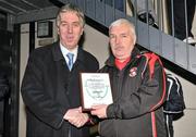 28 February 2012; Secretary of Tolka Rovers Dave Lawlor is presented with a plaque by FAI chief executive John Delaney for the club's generosity for the use of their ground for the final. Umbro CUFL Premier Division Final, IT Carlow v Athlone IT, Frank Cooke Park, Glasnevin, Dublin. Picture credit: Barry Cregg / SPORTSFILE