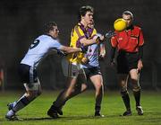 29 February 2012; Michael O'Regan, Wexford, is tackled by Daniel Byrne, Dublin. Cadbury Leinster GAA Football Under 21 Championship, Wexford v Dublin, Belfield, Enniscorthy, Co. Wexford. Picture credit: Matt Browne / SPORTSFILE